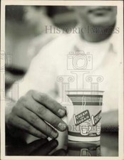 1959 Press Photo Man drinks coffee from paper cup - lrs24089 picture
