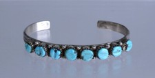 Zuni Row with 8 carved turquoise settings picture