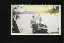RP Man Holds Up Stringer Of Crappie Fish Next To Boat With Johnson Motor Fishing picture