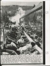 1965 Press Photo Skiers behind reflecting glass partition at Mt. Snow, Vermont picture