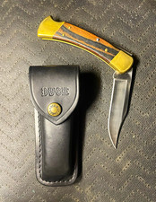 Buck 110 Folding Pocketknife Stainless Clip Point Wood/Brass Handle Sheath picture