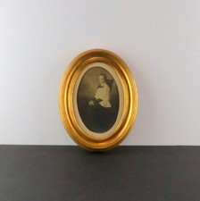 Catholic Altar Boy seated in chair, slick hair, ca 1900s Vintage Photo in Frame picture