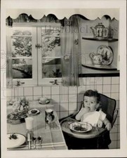 1947 Press Photo Toddler eating lunch designed by Gaynor Maddox - nei26321 picture