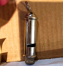 The vintage cylindrical metal whistles made in Hong Kon picture