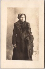 c1910s STUDIO Photo RPPC Postcard Young Woman in Winter Coat & Glasses /Fur Muff picture