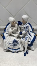 Porcelain Colonial Couple Figurine Blue White Gold Trim Seated on Sofa picture