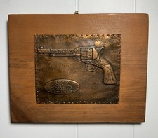 Vintage wooden wall plaque embossed copper plate Colt .45 Single Action revolver picture