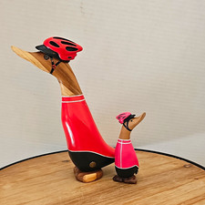 Dcuk cyclist Wood Duck Figurines wearing Helmets in Red & Pink Outfits picture