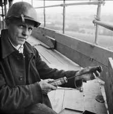 Worker loading a riveting gun during the construction of two sugar - Old Photo picture