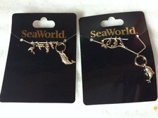 2 SeaWorld Charm Necklaces: Orca (killer whale) & Dolphin picture