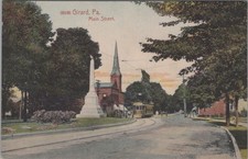 Girard Main Street PA 1910s Streetcar Obelisk Church Steeple Postcard picture
