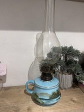 An antique finger oil lamp with custard glass font, brass burner & glass chimney picture