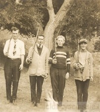 1914 Four Young Men Guns Over Shoulders Like Tin Soldiers RPPC picture