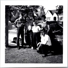 Family Posing by Vintage Car in Suburb, 1965 B&W Snapshot Photo picture