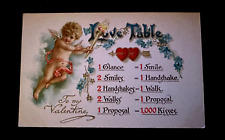 Cupid with Torch ~Flowers ~Hearts Love Table ~ Antique Valentine Postcard~g513 picture