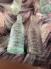 2 straight sided 1900s coca cola bottles montgomery ala. clear and aqua. gd von picture