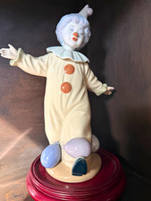 Nadal collectible porcelain Clown Figurine on wood  Base, balances balloons. picture