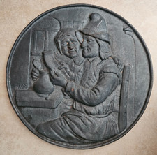 Vintage Heavy Cast Iron German/Dutch Couple Wall Plaque Tavern Scene 11.5 diam picture