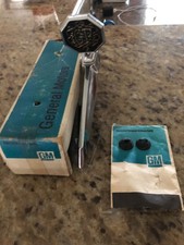 1975 Grand Prix NOS HOOD ORNAMENT AND BASE COMPLETE WITH HARDWARE picture