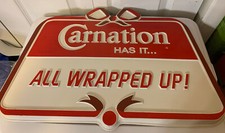 Vintage Carnation Has it   All Wrapped up Dairy General Store Sign Plastic picture