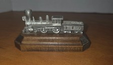 Vintage pewter steam locomotive on wooden base, collectible picture