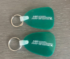 (2) Vintage AARP  ITT Hartford Green Rubber Keychains picture