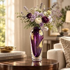 A heavy Murano hand-blown glass vase featuring deep purple glass with 14k gold picture