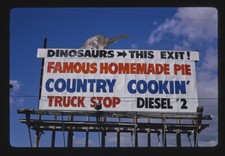 Wheel in mini Mart sign 24 Hour Art Show Cabazon California 1980s Old Photo picture