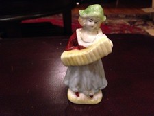 Girl Dressed in Blue Playing Accordion Figurine picture