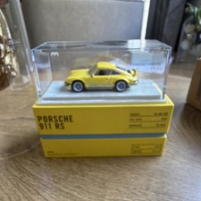 Porsche 911 RS Yellow 1:43 Diecast Model Car with Display Case picture