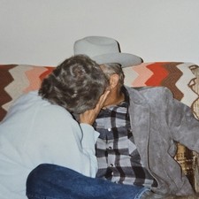 Vintage Color Photo Snapshot of Older Couple Kissing on Couch picture