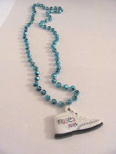 2023 KREWE OF MUSES SIGNATURE POLYSTONE EMBLEM (SNEAKER SHOE) MARDI GRAS BEAD picture