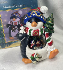 Traditions Hand Painted Penguin Porcelain Spinning Musical Figure picture