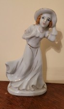 Vintage Made in Occupied Japan Figurine Windblown Lady white with gold accents. picture
