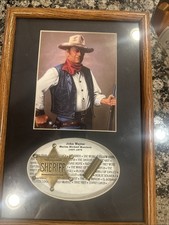 Framed Vintage John Wayne Collectible Portrait With Gold Sheriff Badge And Bulle picture