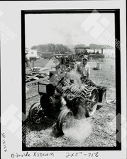 1982 A man sitting on a steam tractor picture