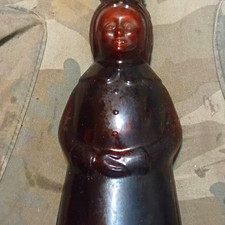 Brown/Amber Glass Girl Figural Bottle, Embossed Bow, Base Marked 6529, 84 oz picture