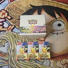 3x Booster Bundles & Pokemon 30th Anniversary Mini Tin Display picture