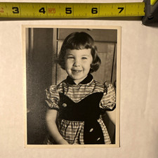 Vintage Black & White Portrait Photograph of Smiling Young Girl in Dress picture