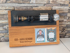 Obi-Wan Kenobi Lightsaber & Ewan McGregor Autograph & Piece of His Robe picture