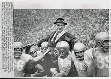 1965 Press Photo UCLA Coach Tommy Prothro carried off field in Los Angeles picture