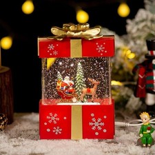 Avon Light Up Gift Box Santa Claus Reindeer Snow Globe New in Box picture