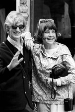 Two British young people smiling front of shop window of Trecamp T- Old Photo picture