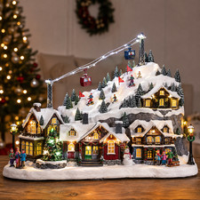 11.5 in. H Christmas Oversized Resin Lighted Musical Skiing Christmas Village picture