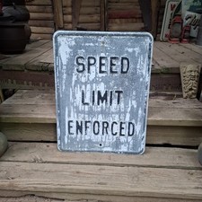 Vintage heavy metal embossed speed limit enforced street sign picture