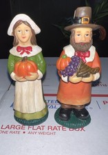Pair of Thanksgiving Pilgrim Figurines Man & Woman Holding Pumpkins picture