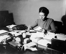 The French writer Simone de Beauvoir seated Reading at Her Desk 1953 Old Photo picture