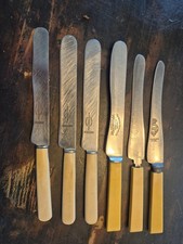Vintage Sheffield straight bladed knives pale colored handle stamped logo picture
