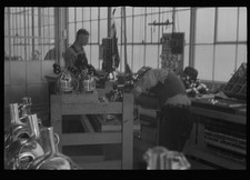 Photo:1930s Factory Workers Inspecting Metal Parts Workshop Interior picture