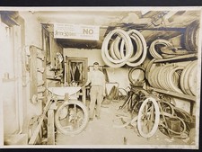 Young Man In Tire Shop Interior Antique Cabinet Photo picture